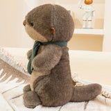 peluche-loutre-écharpe-marron